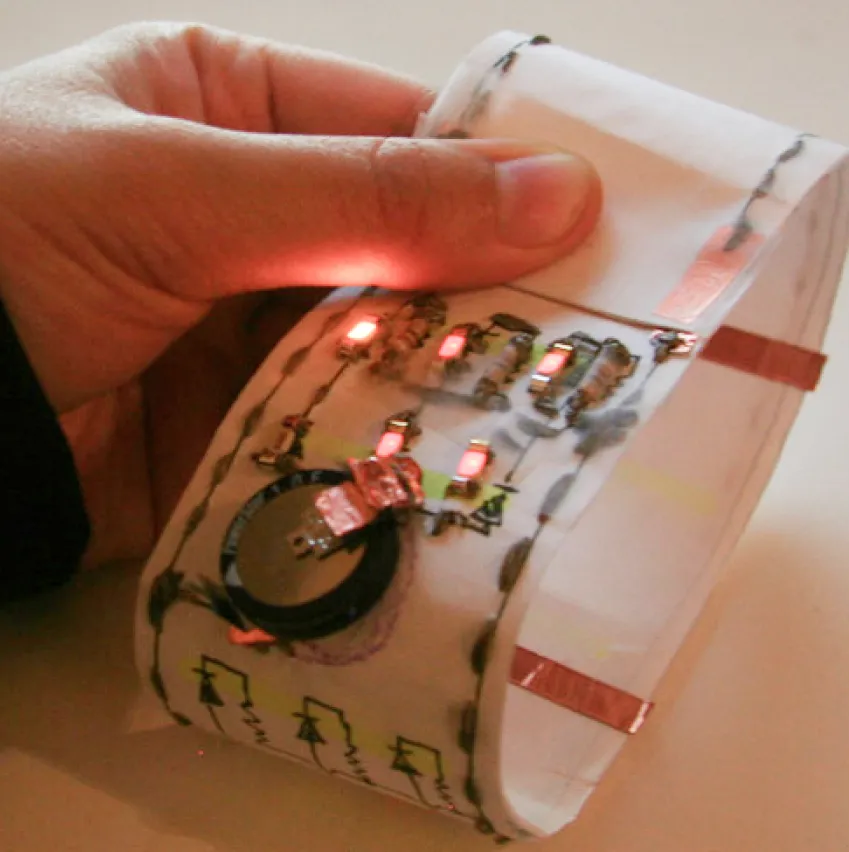 Paper circuit rolled to a circle with LEDs turning on